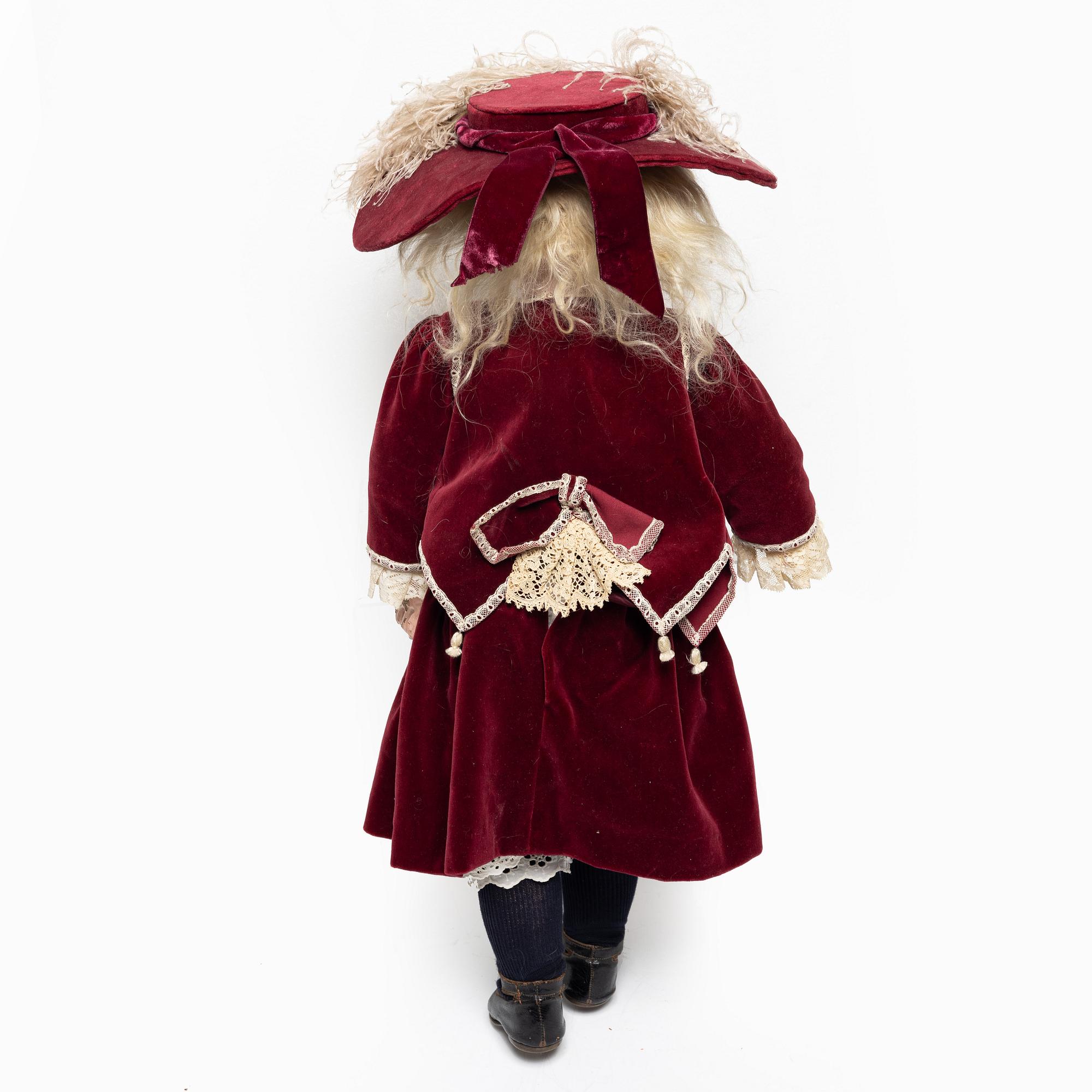 Girl doll, likely France, around the year 1900.