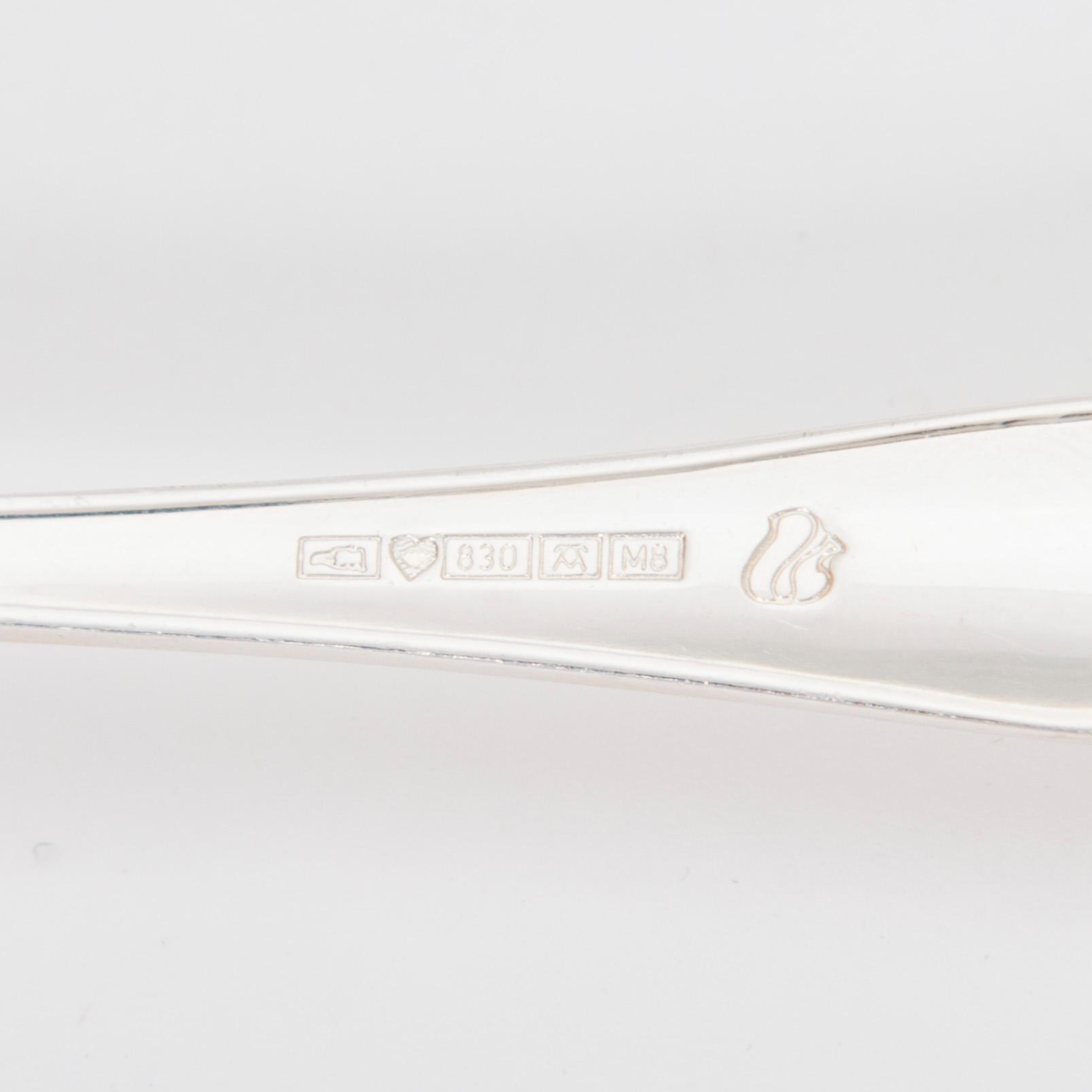 A 50-piece set of 'Chippendale' silver cutlery, Auran Kultaseppä, Turku 1989. In two original wooden boxes.