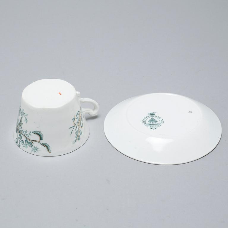 A earthenware table set of 136 pcs "Vexiö Guld",  by Arvid Ekberg, Gustafsberg, from around year 1900.