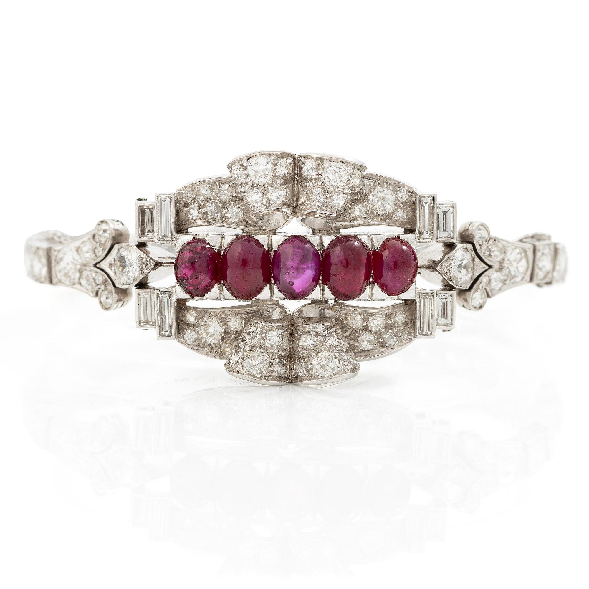 A bracelet platinum set with old- and baguette-cut diamonds and cabochon-cut rubies, circa 1930-40s.
