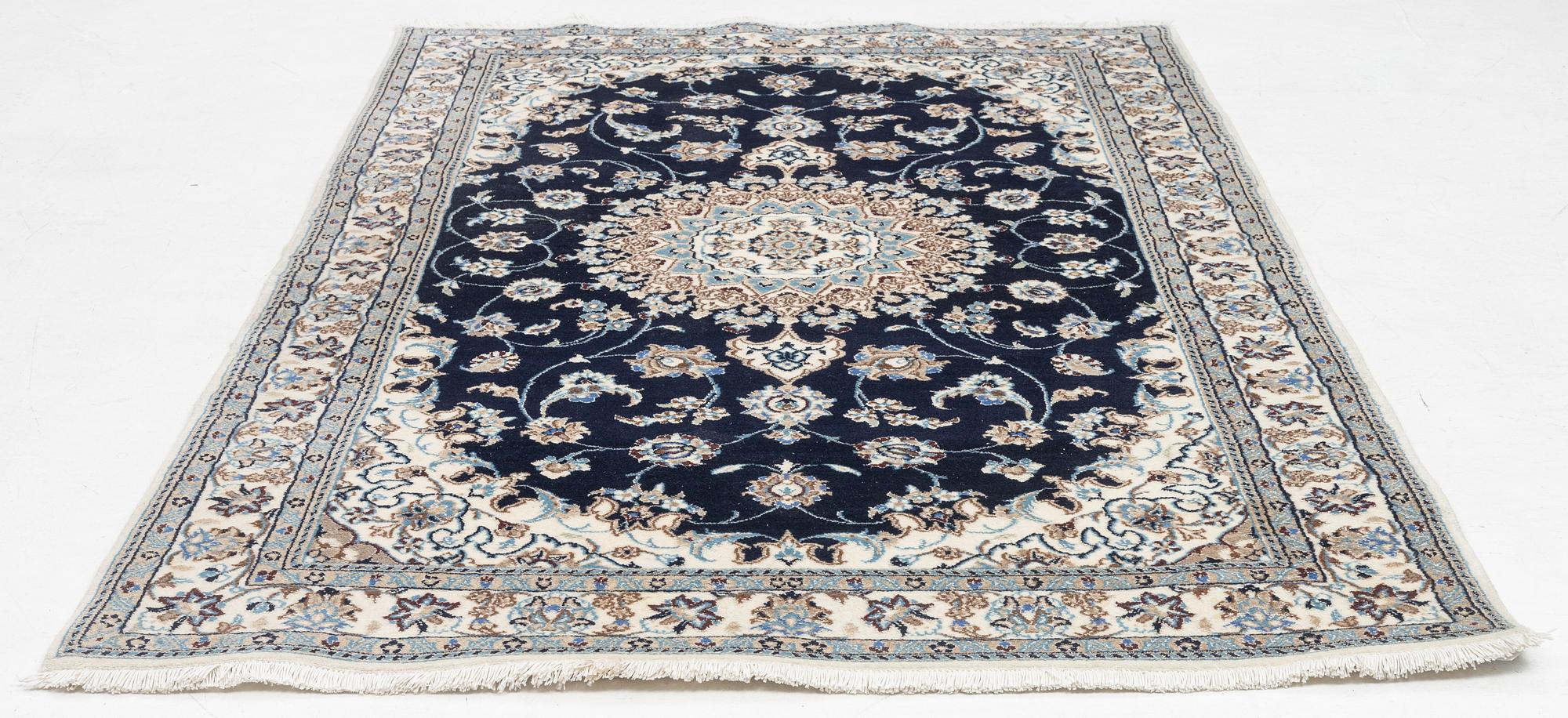 A Nain carpet, c. 255 x 150 cm.
