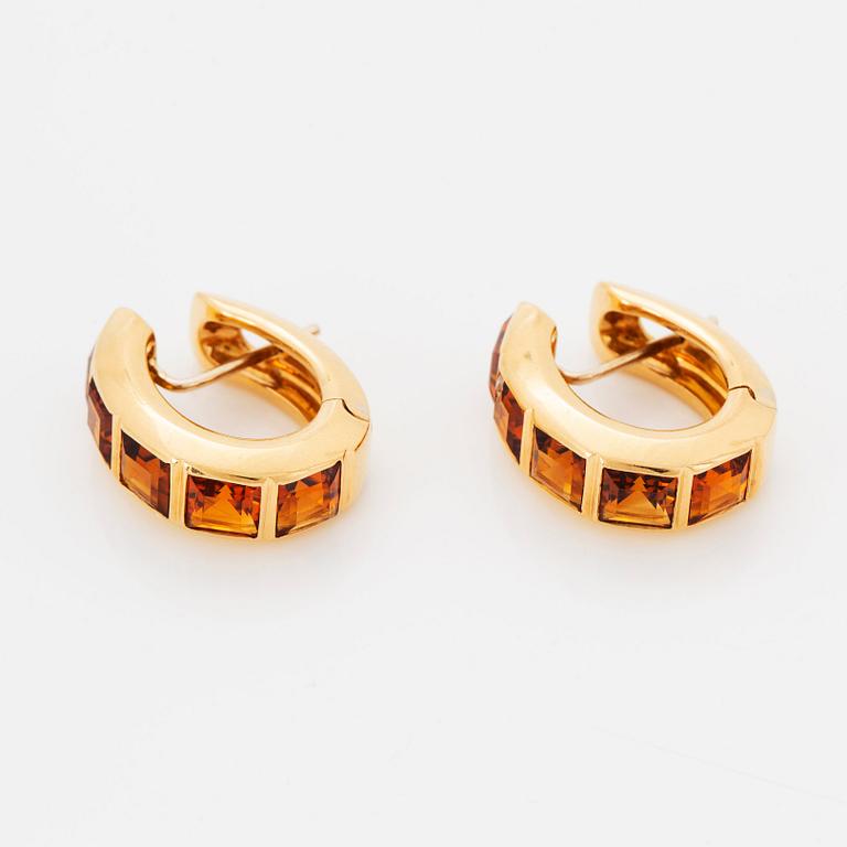 A pair of 18K gold earrings set with step-cut citrines.