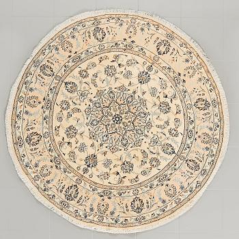 A Nain rug, part silk, diameter ca 150 cm.