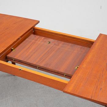 A British teak veneered dining table, 1960's.