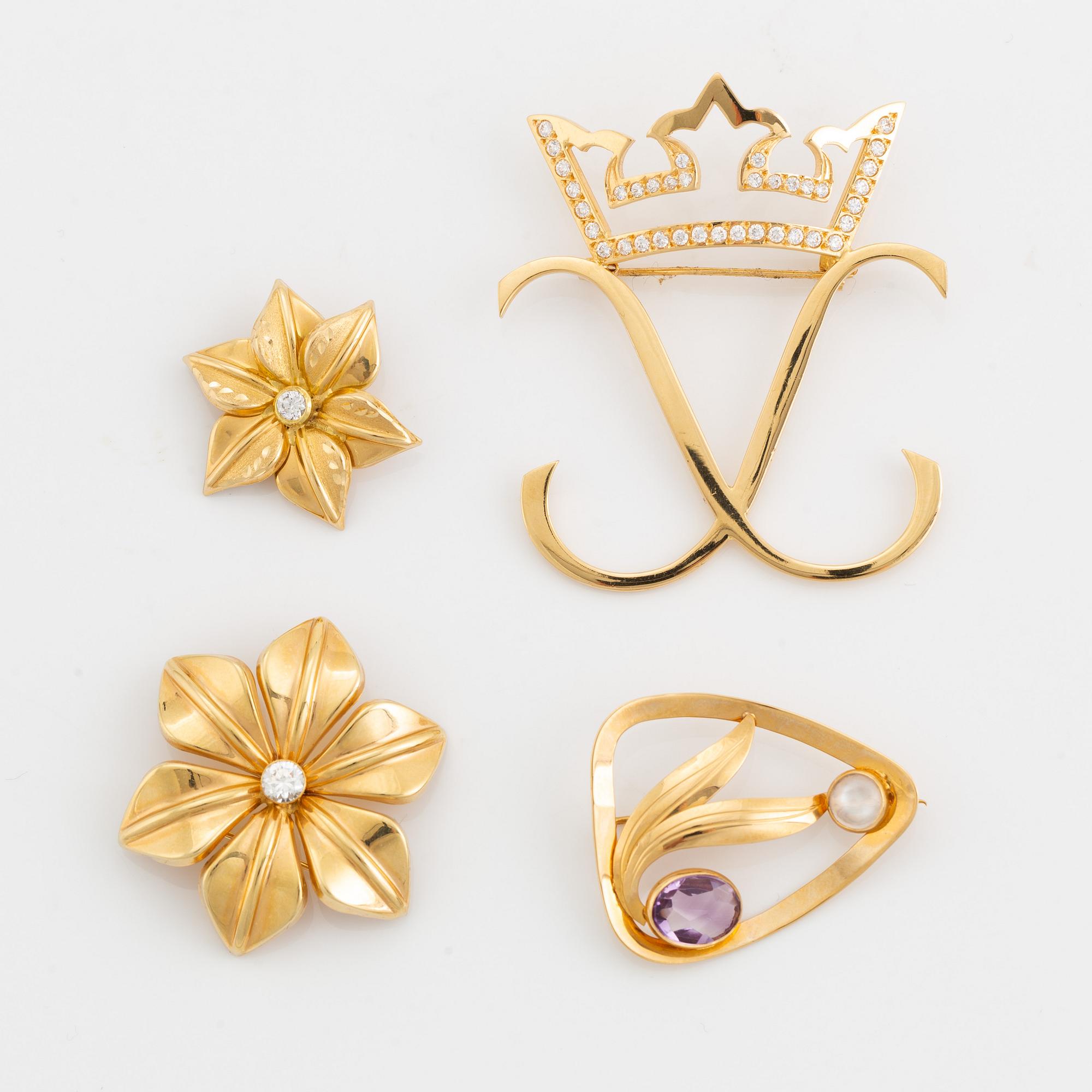 Four 18K gold brooches.