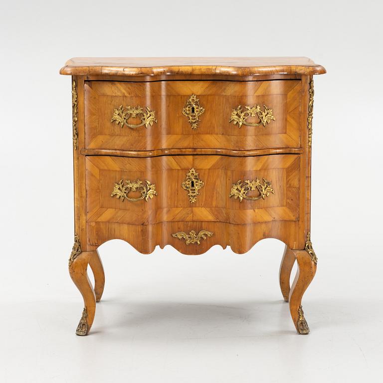 A late Baroque style chest of drawers., early 20th Century.