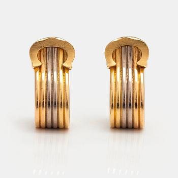 Cartier, " pair of "Ressort CC" earrings made of 18K yellow, red and white gold. Marked Cartier, 976107.