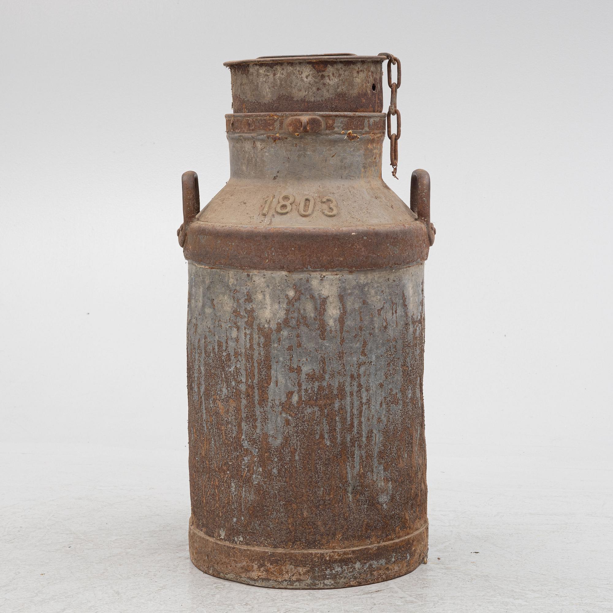 A milk pail, numbered 1803.