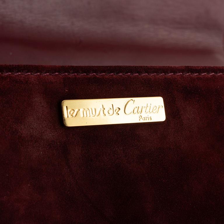 Cartier, A red suede vintage weekendbag.