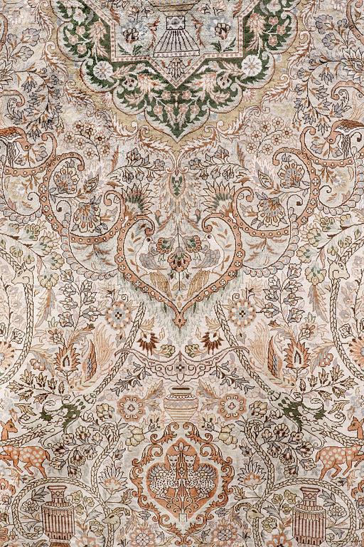 An oval pictoral silk carpet, ca 273 x 180 cm.