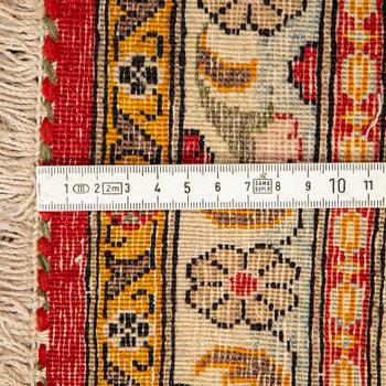 A CARPET, semi-antique Qum, ca 341 x 238 cm.