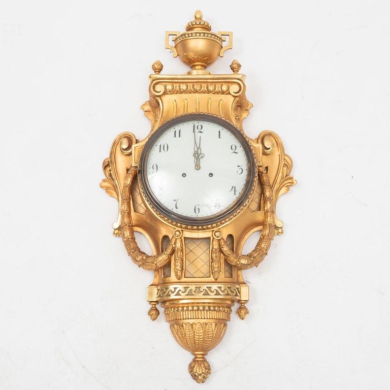 A Gustavian style pendulum wall clock, 20th Century.