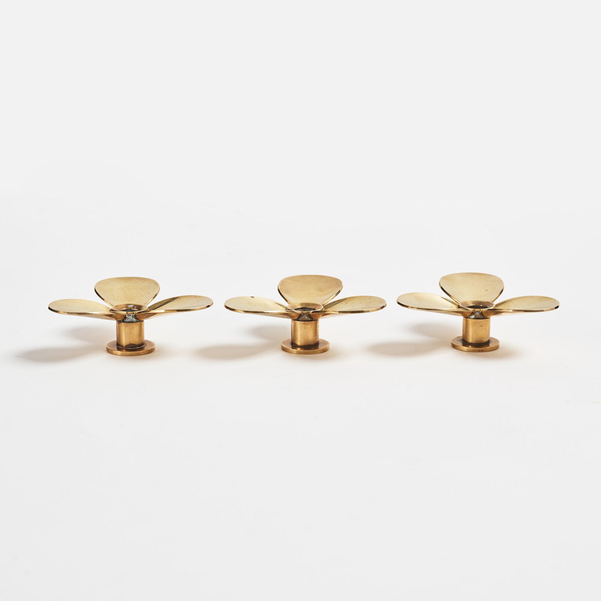 Pierre Forssell, three brass 'Treklövern' candleholders, Skultuna, 1981.