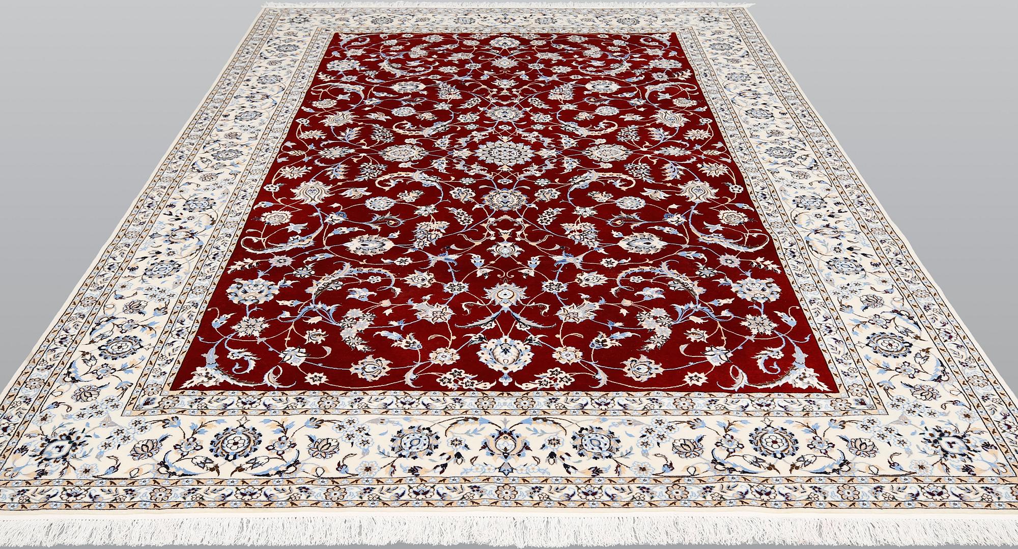 A Nain part silk carpet, 302 x 204 cm.