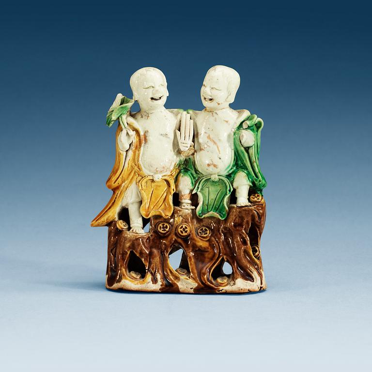 A figure of 'laughing boys', Qing dynasty, 18th Century.