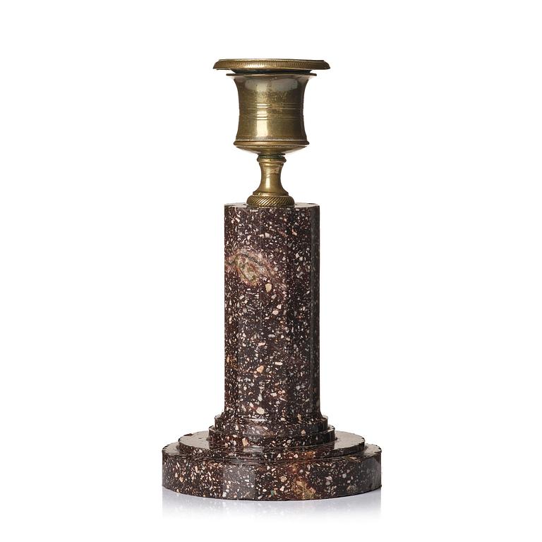 An Empire 'Blyberg' porphyry candlestick from Älvdalen, first part 19th century.