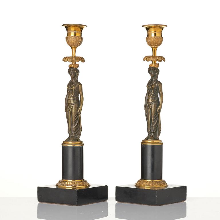A pair of late Gustavian marble and ormolu candlesticks in the manner of F. L. Rung (1758-1837).
