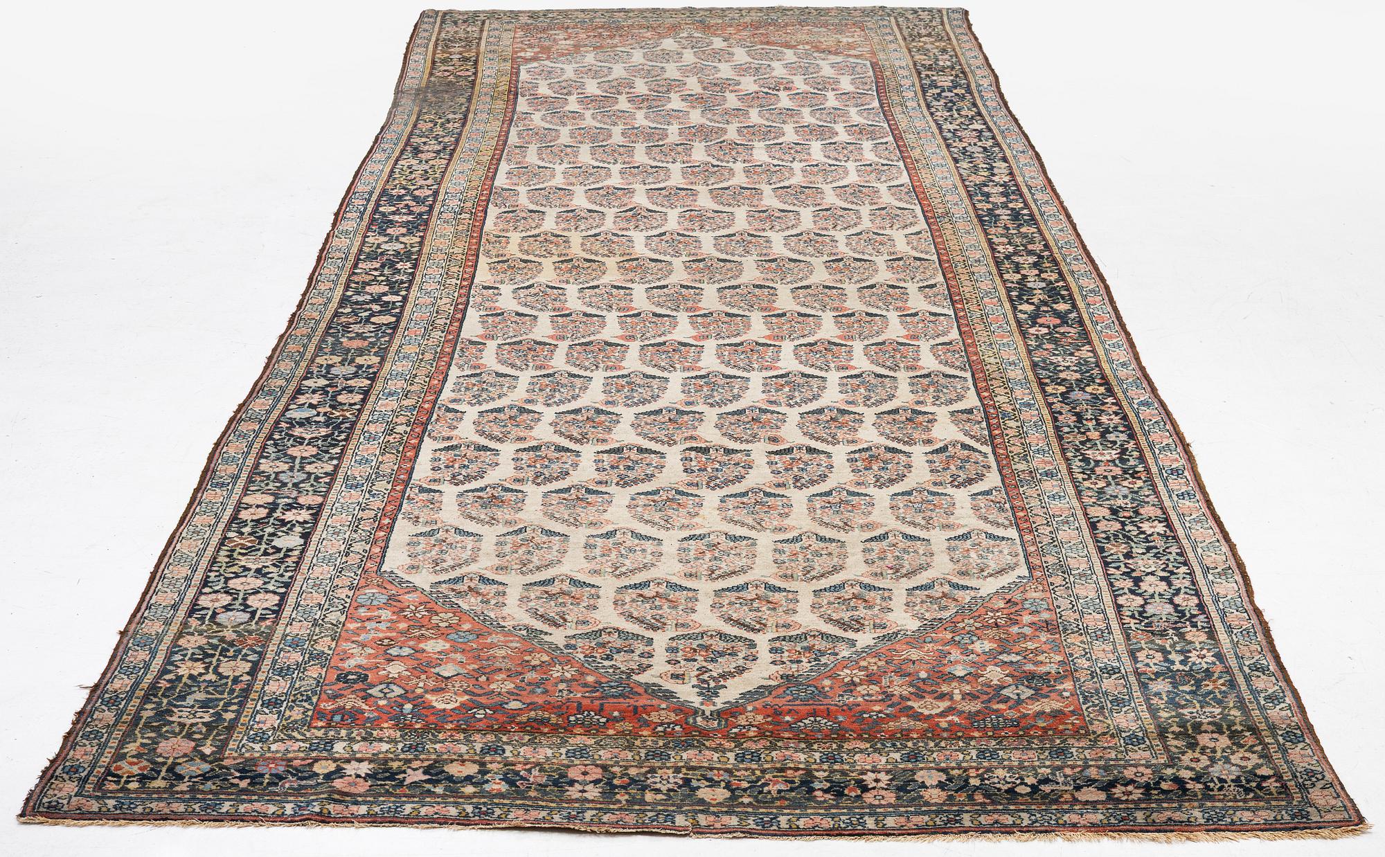 A Bakhtiari carpet, signed, c. 580 x 212 cm.