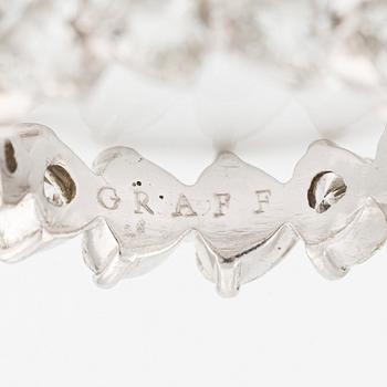 A Graff platinum eternity band set with heart shaped diamonds.
