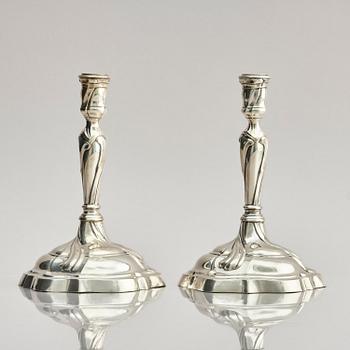 A pair of German silver Rococo candlesticks, marks of Johann Jacob Baur, Augsburg 1777-1779.