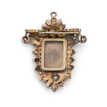 An early 19th century brooch/pendant set with a miniature surrounded by old-cut diamonds and fresh-water pearls.