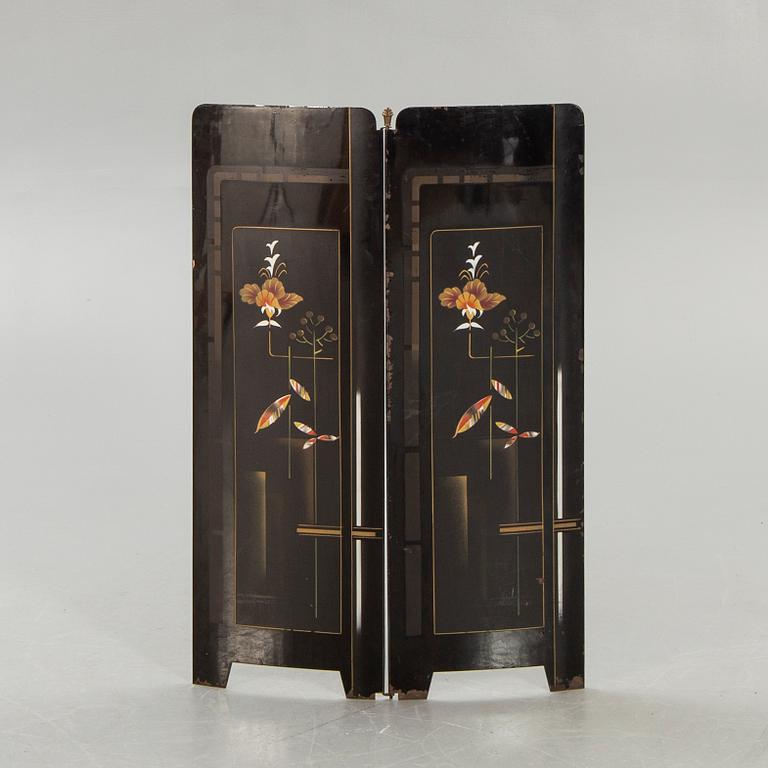 An early 1900s fire screen.