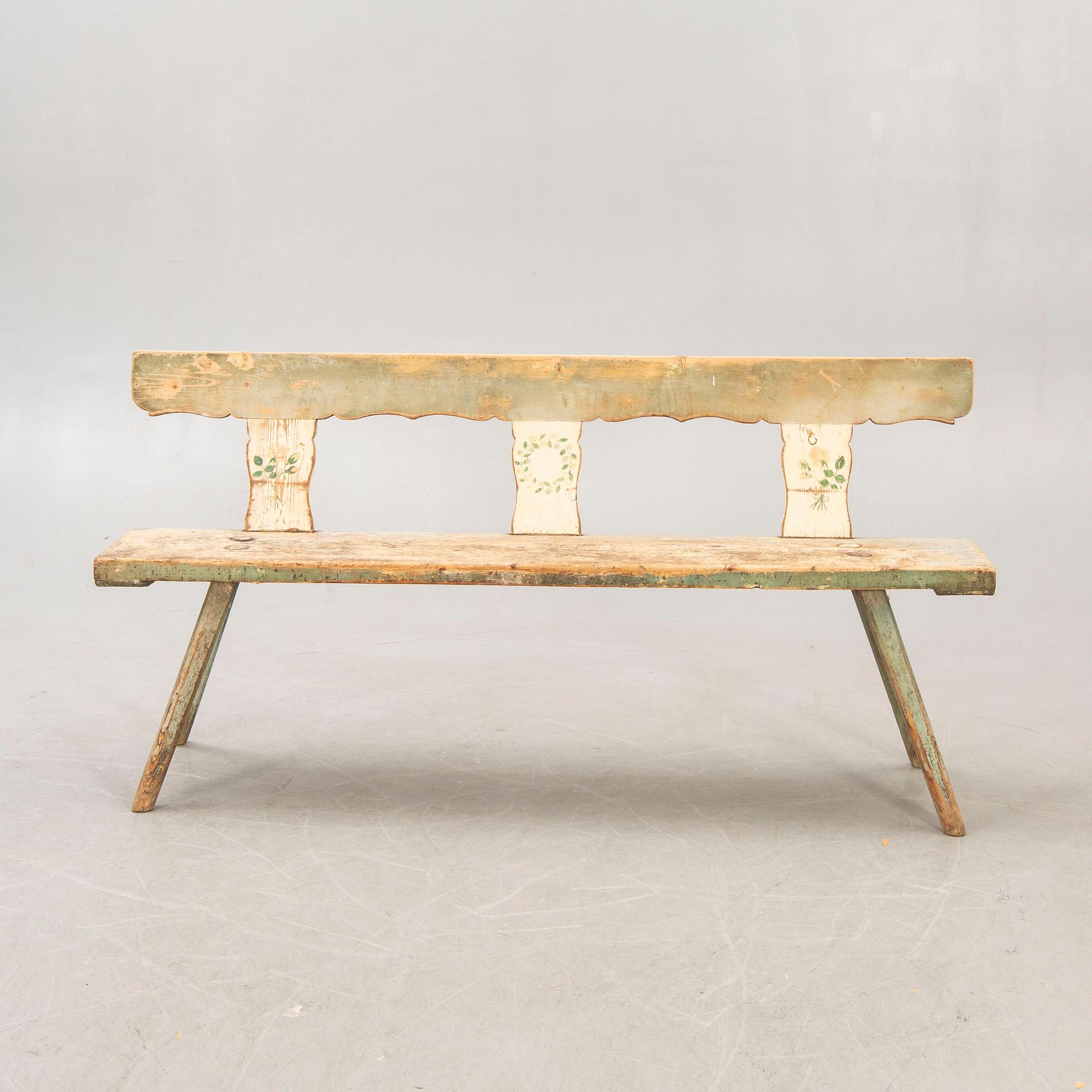 A painted early 1900s bench.