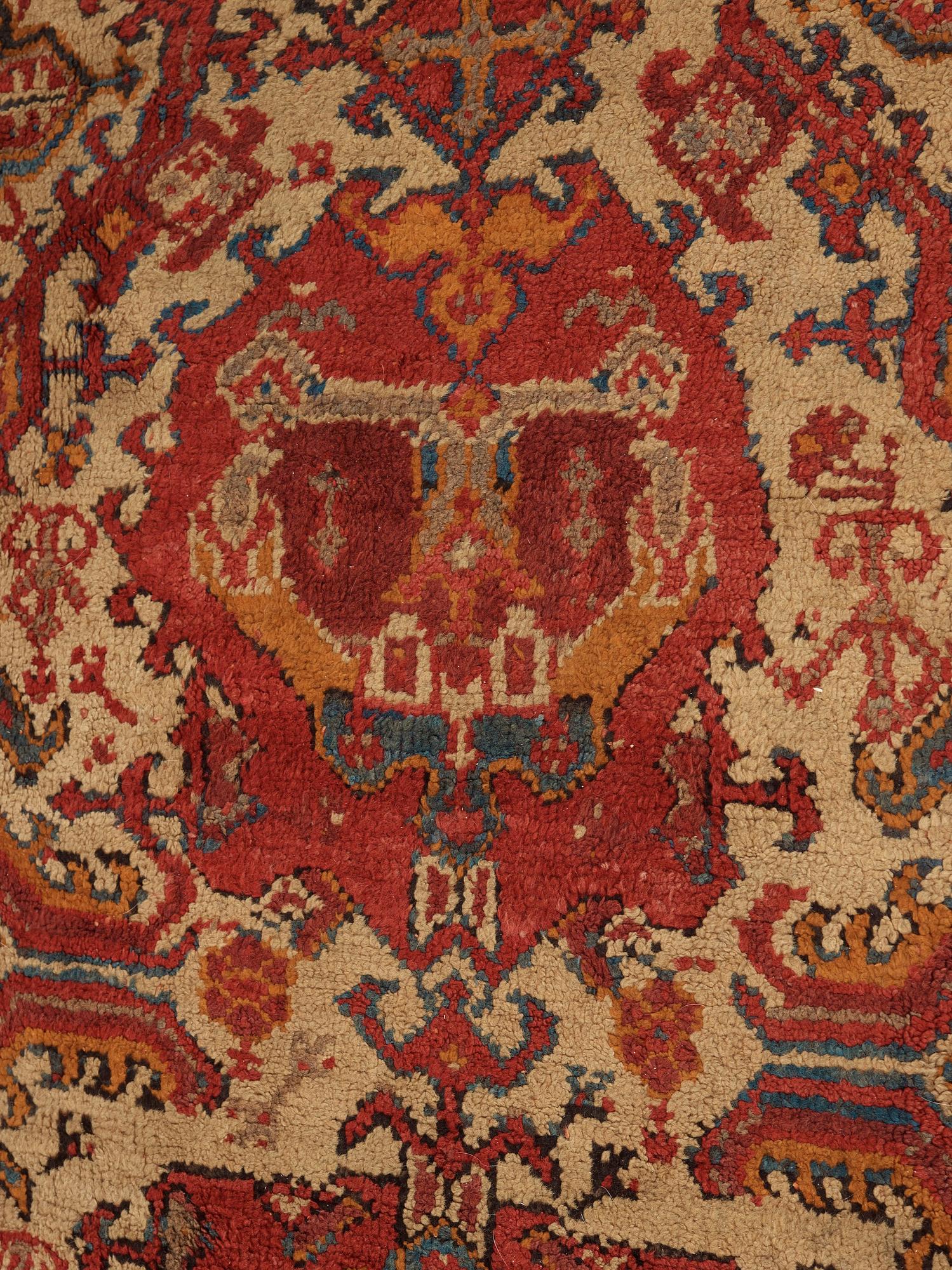 A CARPET. An antique Ushak. 554,5 x 480 cm.