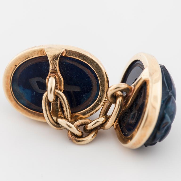 A pair of carved lapis lazuli cufflinks.