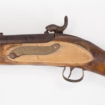 A percussion lock rifle, mid 20th century.