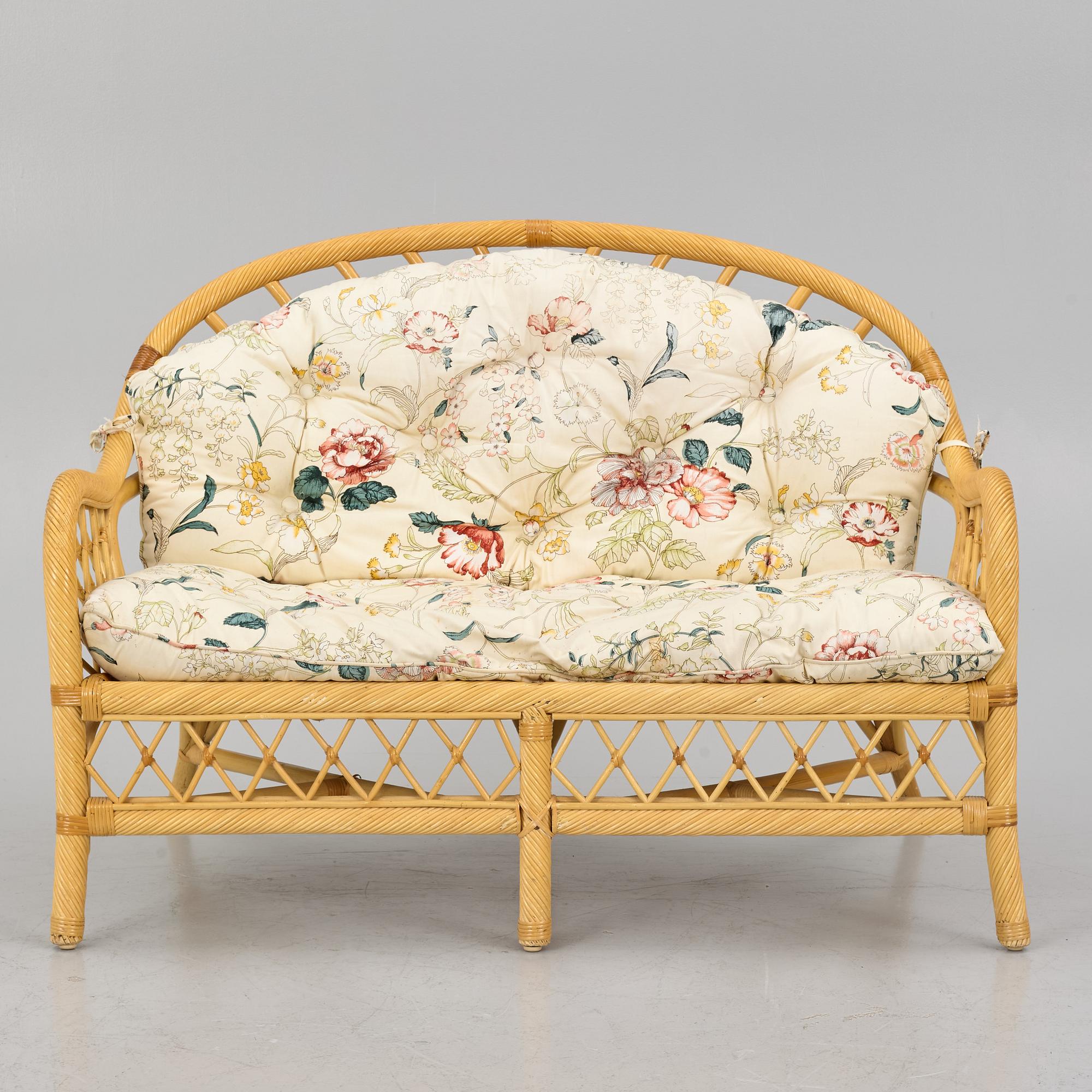 A rattan sofa and two armchairs, later part of the 20th century.