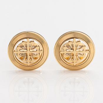 Patek Philippe, A pair of 18K gold "Calatrava" cufflinks. Marked Patek Philippe Geneve.