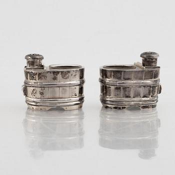 A set of three Japanese silver coasters and a pair of salts with shakers, 20th century.