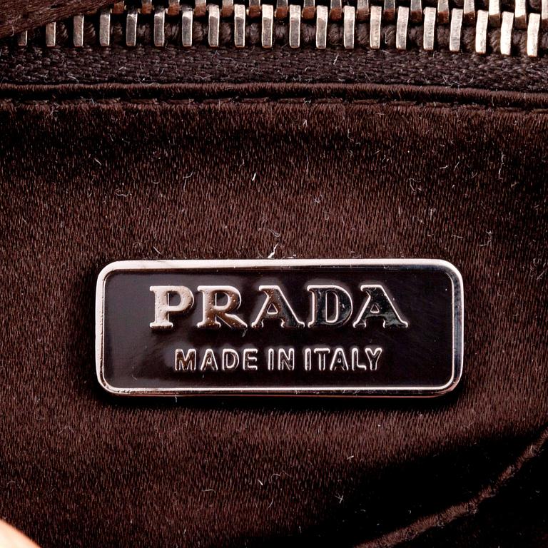 PRADA, a brown silkblend evening bag.