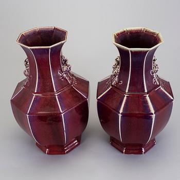 A pair of flambé glazed bronze shaped vases, about 1900.