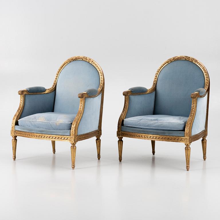 A pair of easy chairs, Louis XVI style, 20th century.