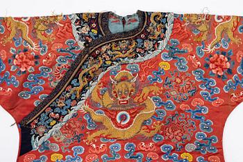 An embroidered red ground five clawed dragon 'female' formal robe, Qing dynasty, 19th century.