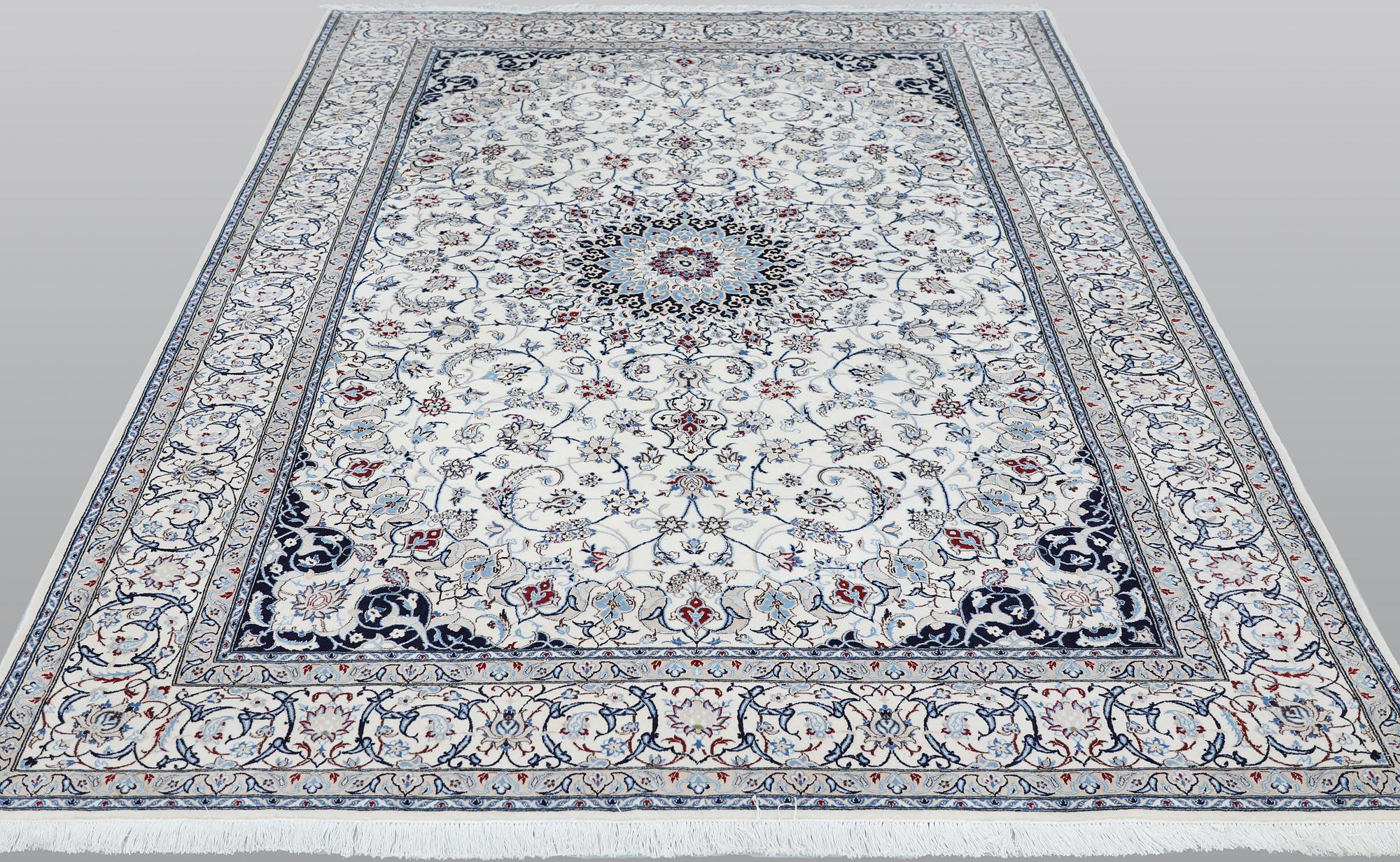 A Nain carpet, part silk, so called 6LAA, approximately 279 x 200 cm.
