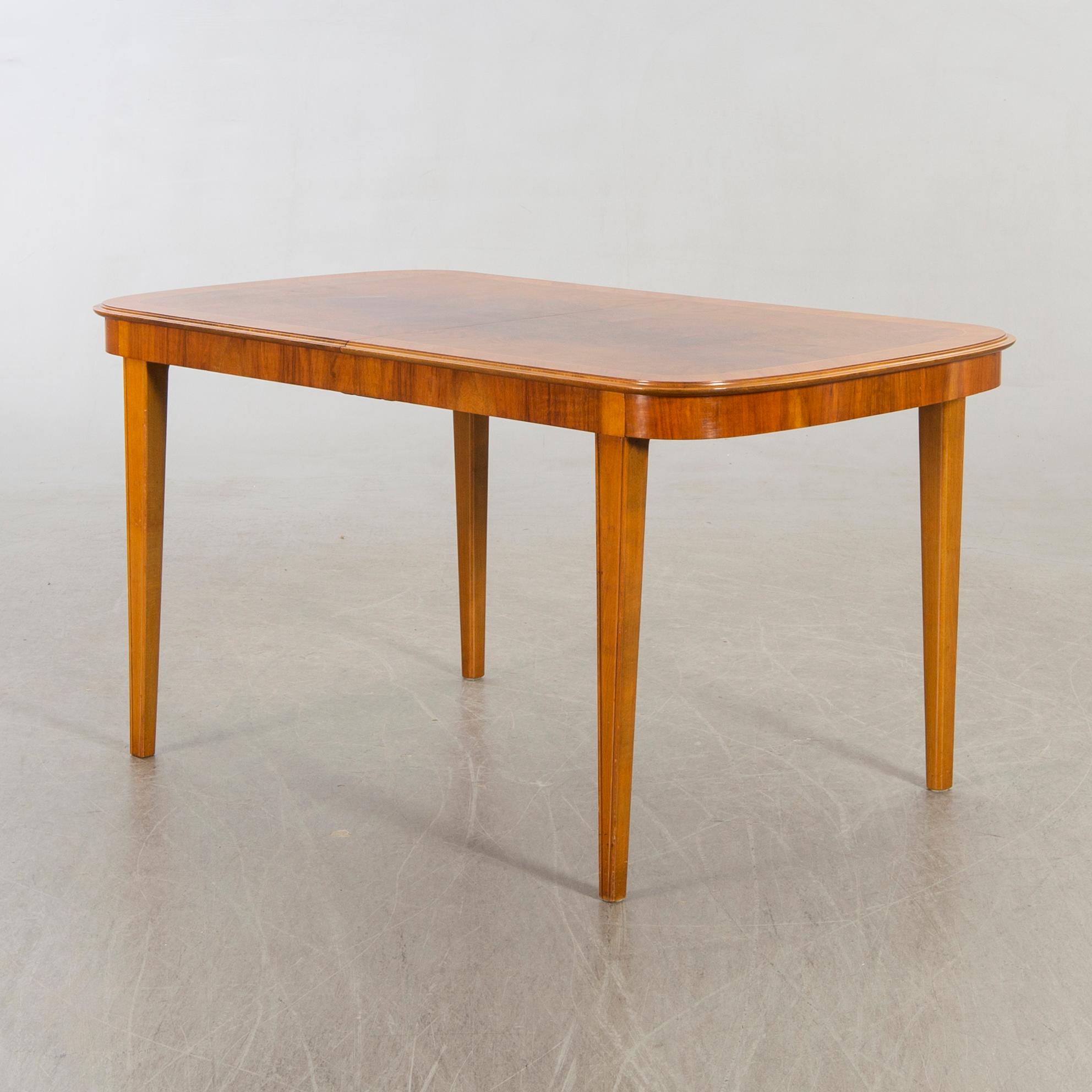 A 1950/60's dining table and chairs.