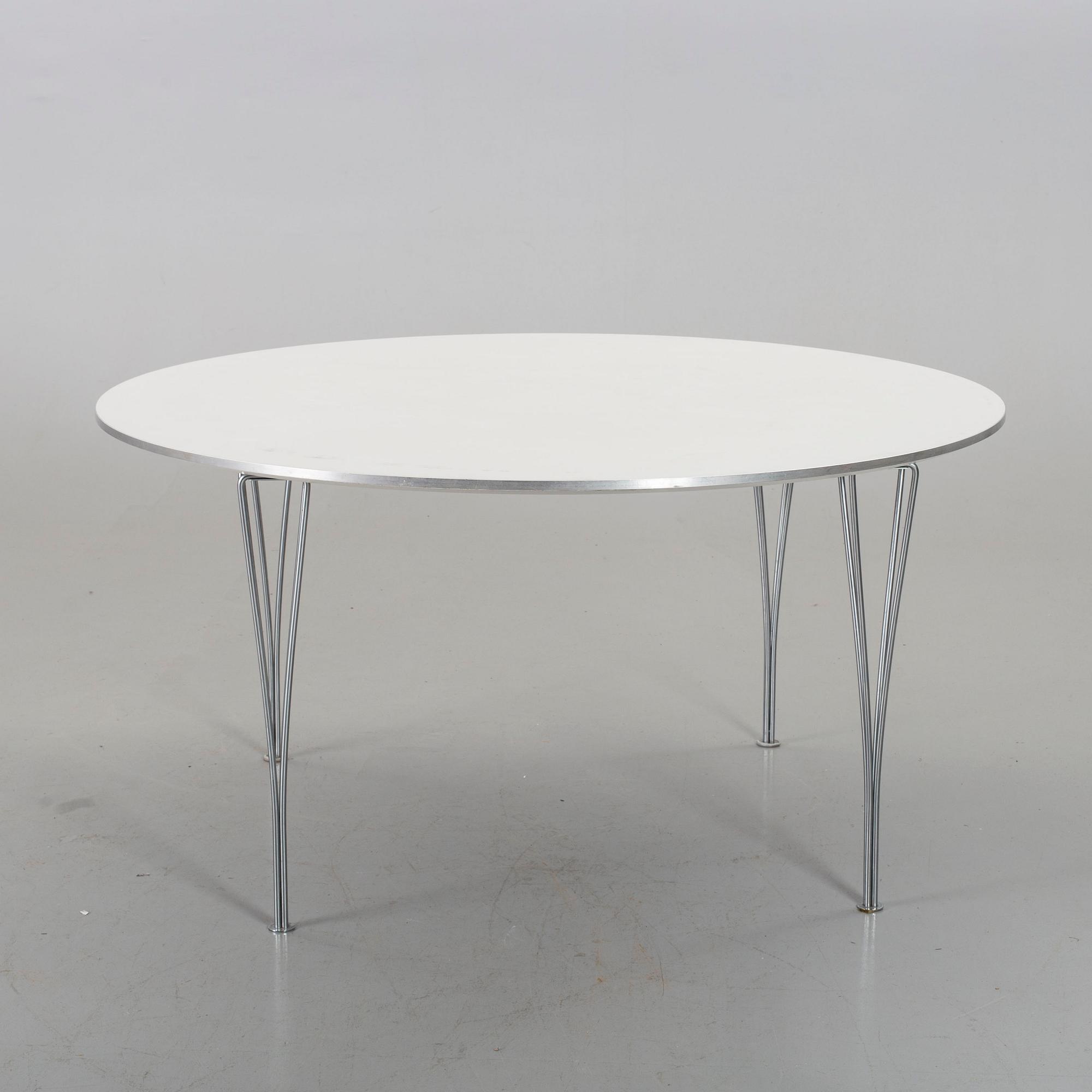 A TABLE BY BRUNO MATHSSON, PIET HEIN & ARNE JACOBSEN FOR FRITZ HANSEN.