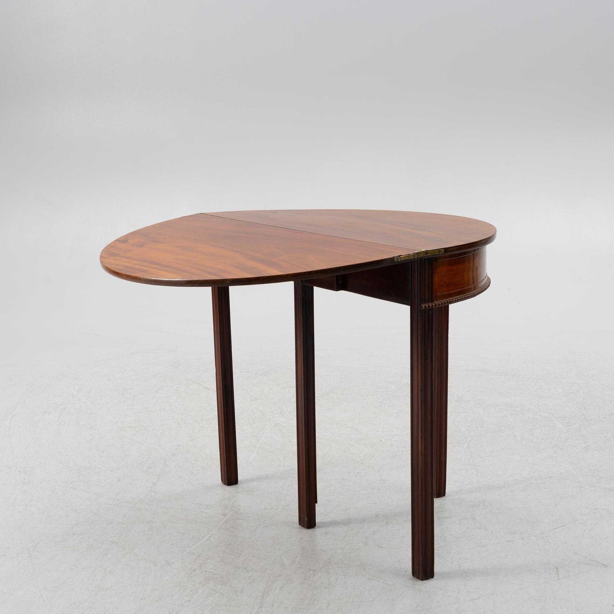 A late Gustavian mahogany games table by J. F. Wejssenburg (master in stockholm 1795-1837).