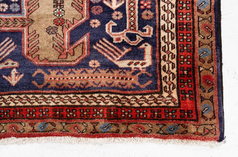 A Sarab carpet, c. 305 x 137 cm.