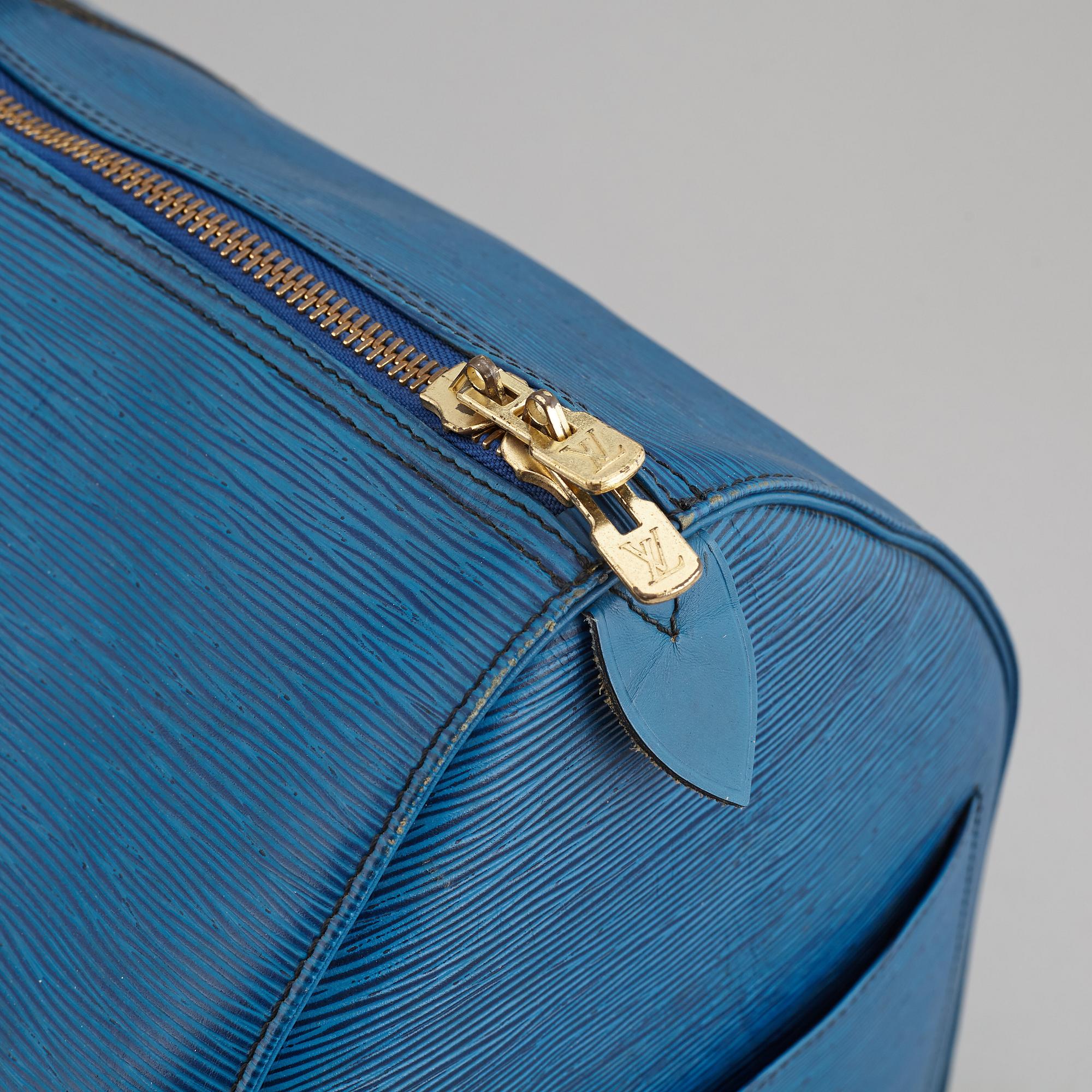 LOUIS VUITTON, a 'Keepall 55 Epi' weekendbag.