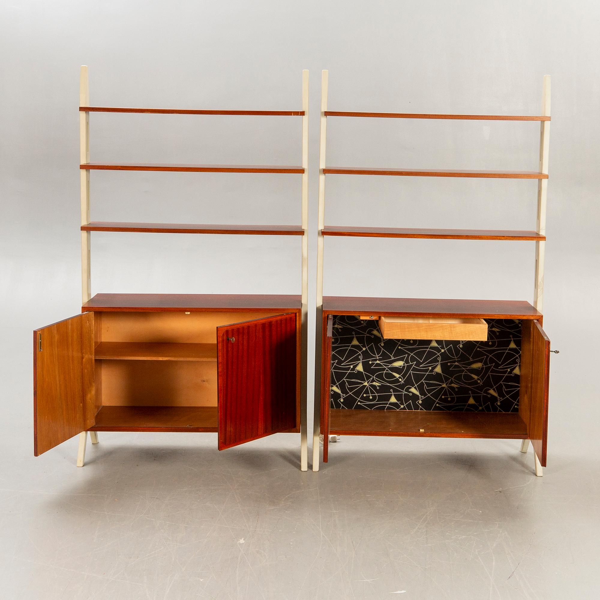 A pair of IKEa "Roxen 1960s mahgony book cases.