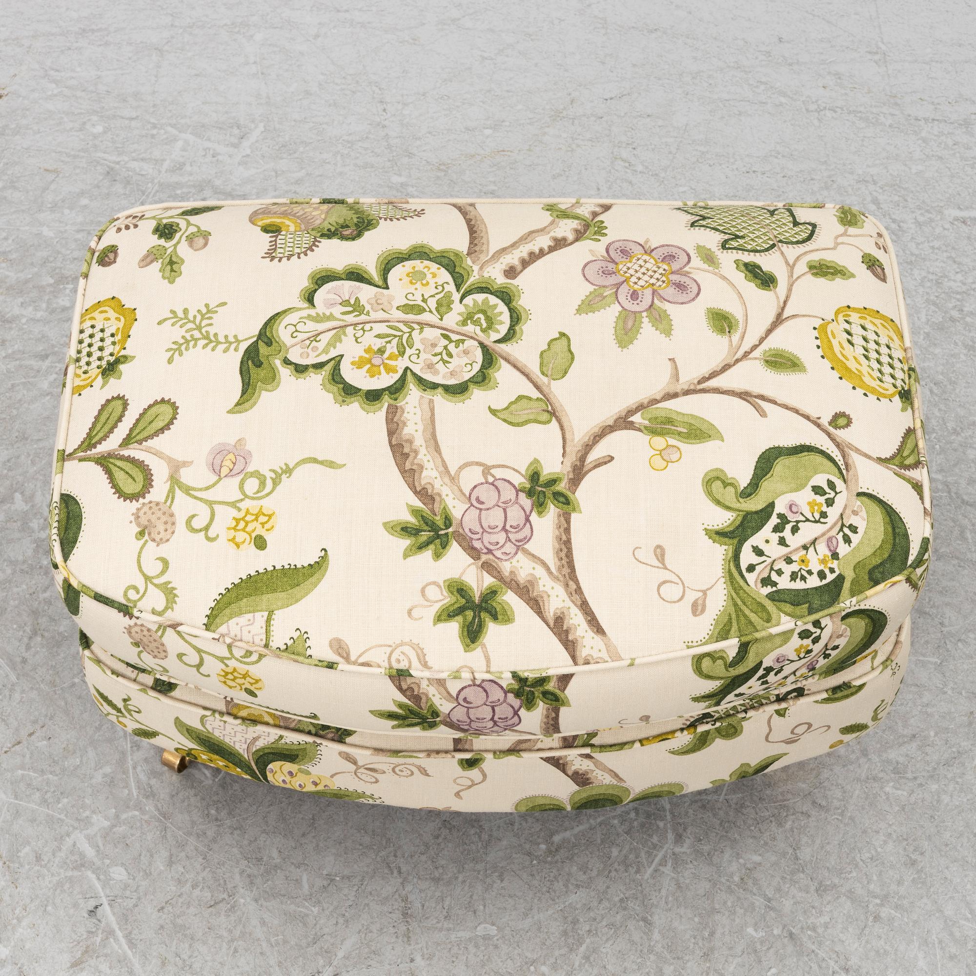 A 'Howard' armchair with footstool, Englesson.