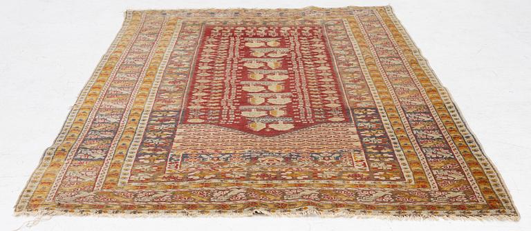 An oriental carpet, c. 195 x 70 cm.