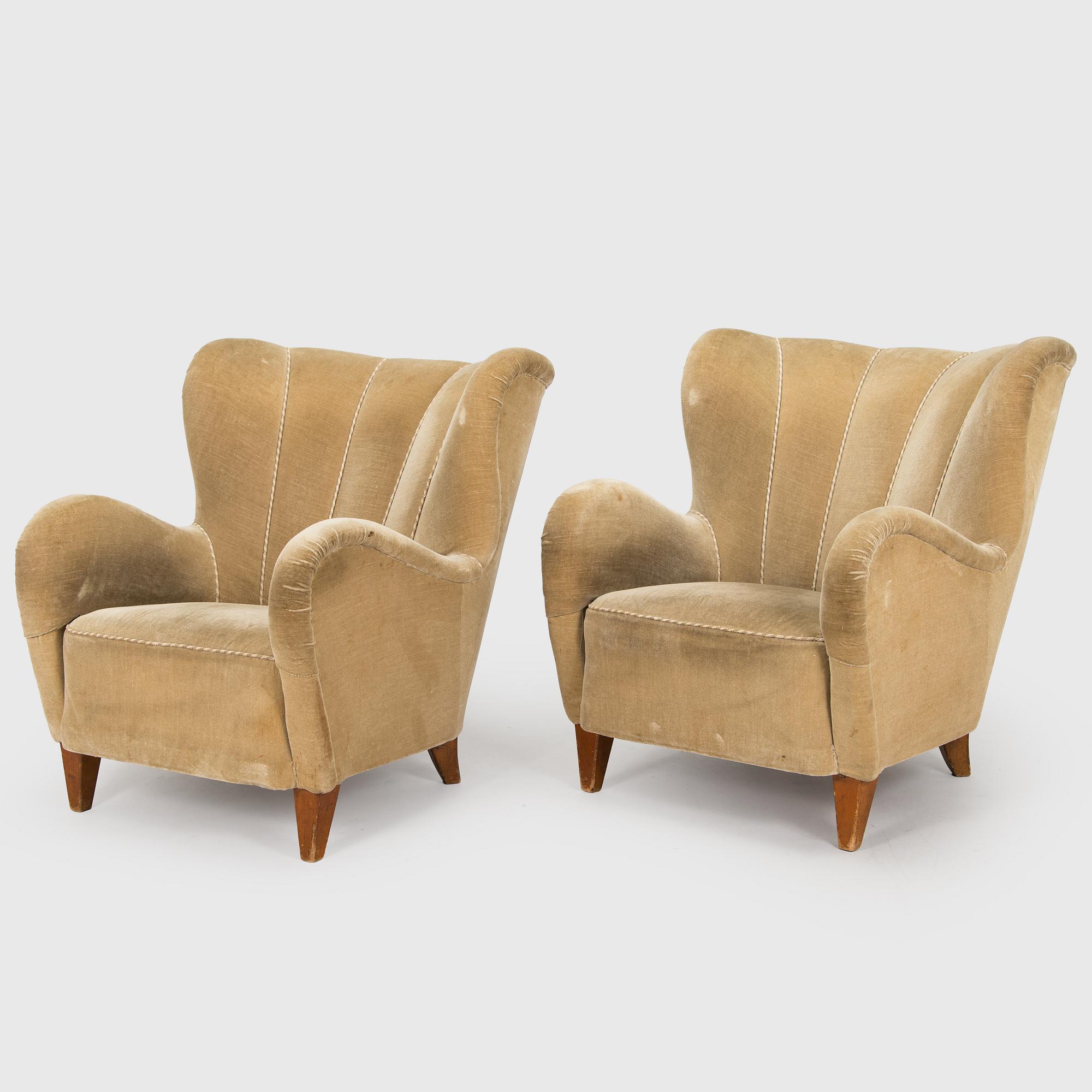 A pair of mid-20th century armchairs.