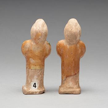 Two green and yellow glazed pottery figures of female attendants, Ming dynasty (1368-1644).