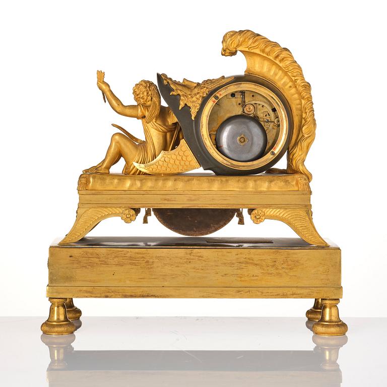 A French Empire sculptural ormolu and patinated bronze mantel clock, early 19th century.