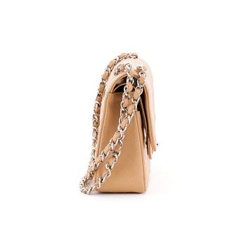 CHANEL, a beige caviar leather "double flap" shoulder bag.